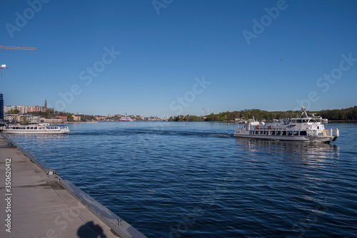 Nacka Strand harbor view with boats and monument in the district Nacka a sunny spring morning in Stockholm. © Hans Baath