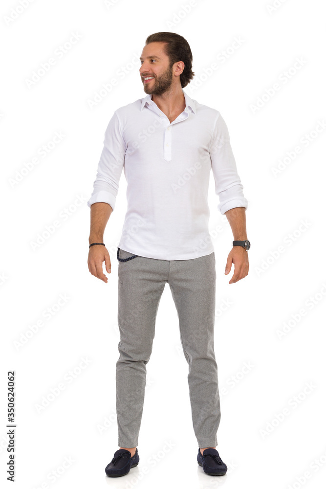 Young Handsome Man Is Standing Relaxed And Looking Away Young Handsome Man Is Standing Relaxed And Looking Away