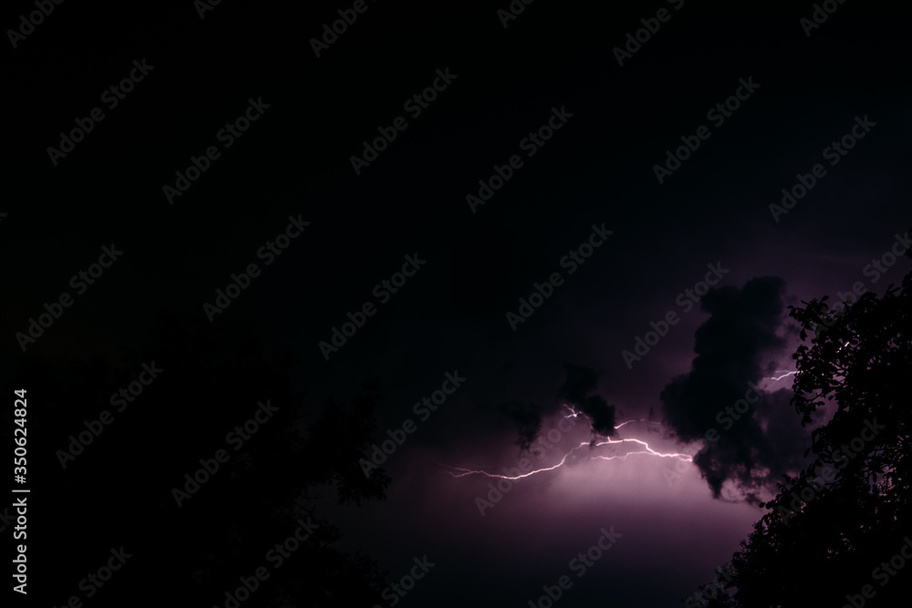 Lightning against the background of the night sky. Night landscape