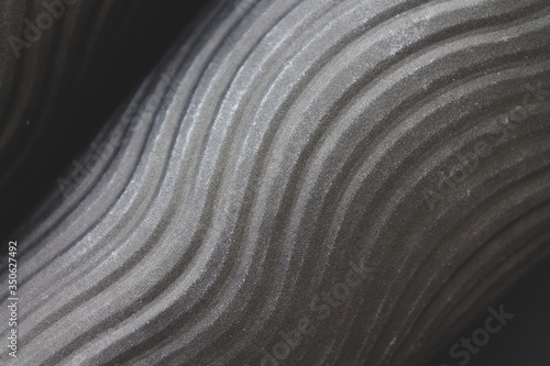 Black monochrome abstract background with volumetric diagonal spiral lines texture. Stylish backdrop for your design work, cards, wallpapers