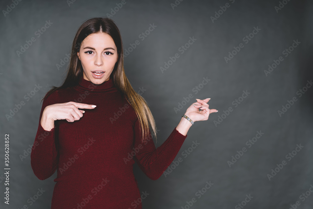 Attractive young lady pointing away Attractive young lady pointing away