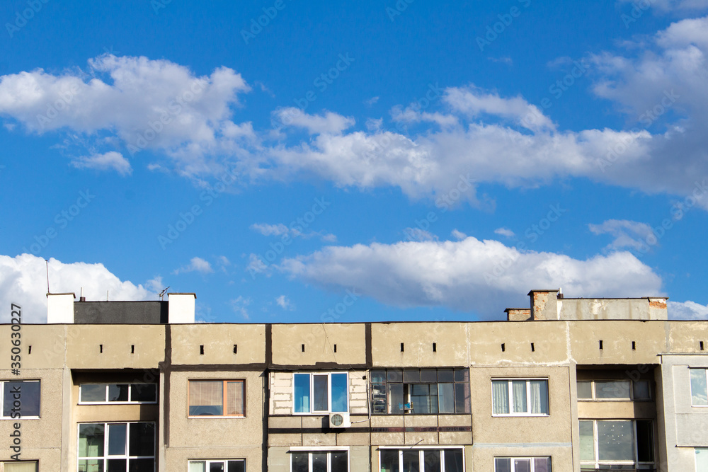 Blue sky behind a soviet block