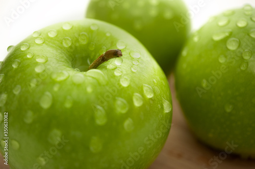 Green Apple on an isolated white background. Proper nutrition. Diet.