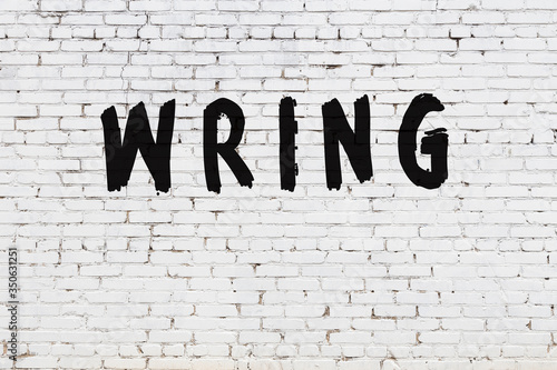 Wall Mural White wall with black paint inscription wring on it