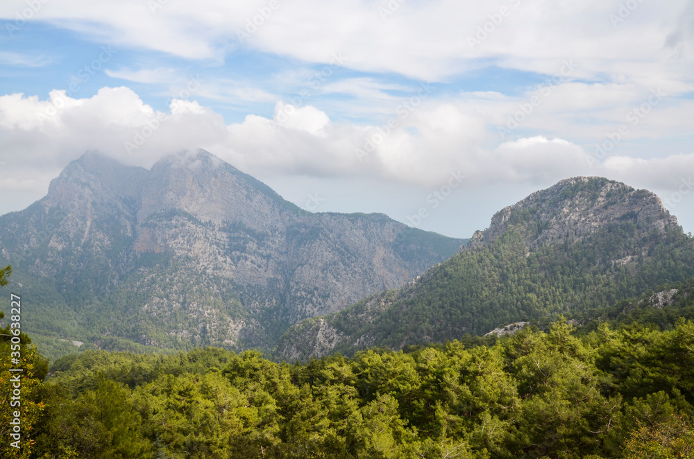 Obraz premium Landscape of the Taurus mountains covered by trees on famous Likya Yolu tourist way in Turkey