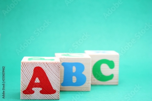 English ABC letters on wooden toy blocks. letters of the English alphabet. Learn foreign languages. English for beginners. Copy space.