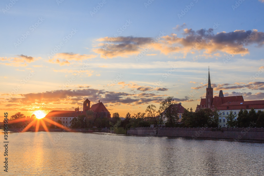 sunset over the Odra River and the historical part of Wroclaw