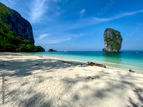The white sand beach of Ko Poda island and the big rocks in the turquoise water surface  Krabi  Thailand