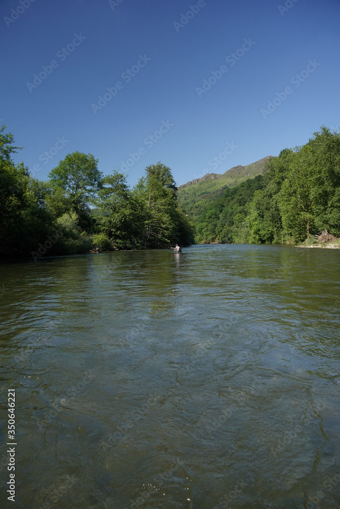 fly trout fisherman in big river fly trout fisherman in big river