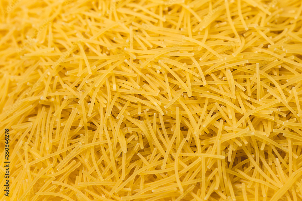 Dry vermicelli pasta ready for cooking. close up with copy space. Food photo. Dry vermicelli pasta ready for cooking. close up with copy space. Food photo.