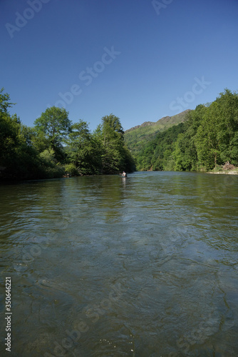 fly trout fisherman in big river