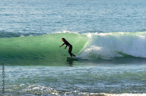 Surfer riding the waves of the sea