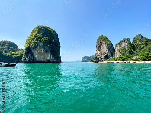 Sailing with a longtail private boat to Railay Beach Bay, one of the most famous luxurious beach of Krabi, Thailand.
