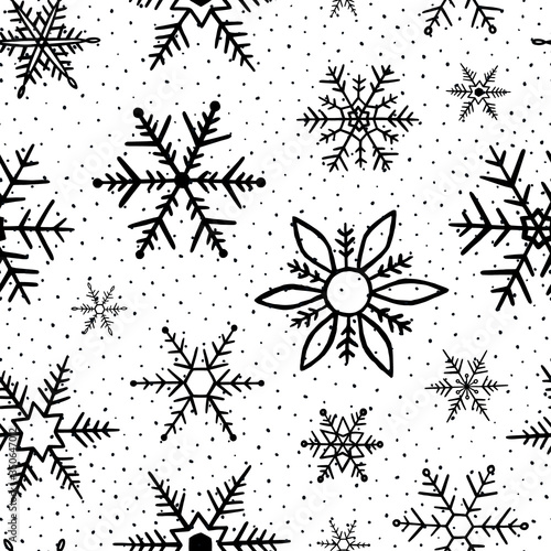 Snowflakes pattern. Seamless pattern snowflake. Winter background. Handdrawn snowflakes. Black and white texture. Repeat snow flakes. Design winter season for prints. Snowflake in doodle style. Vector