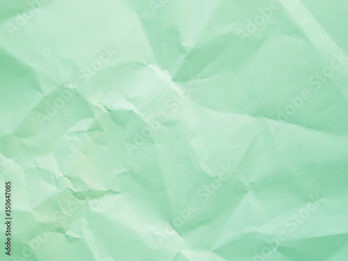 Mint green crumpled paper texture background
