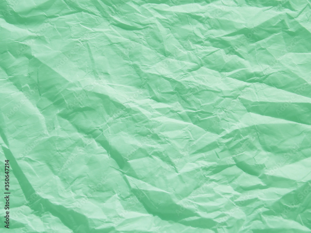 Obraz premium Mint green crumpled paper texture background