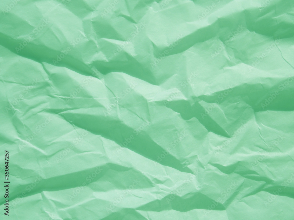Obraz premium Mint green crumpled paper texture background
