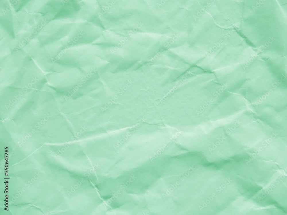 Fototapeta premium Mint green crumpled paper texture background