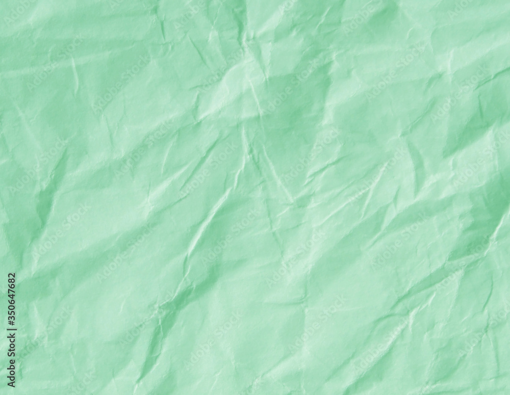Obraz premium Mint green crumpled paper texture background