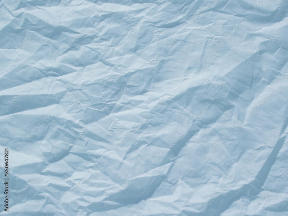 Light blue crumpled paper texture background Light blue crumpled paper texture background