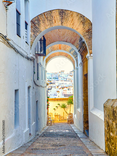 Arch of the Nuns, Arco de las Monjas, in the Jewish quarter of Vejer de la Frontera downtown. Cadiz province, Andalusia, Spain. photo