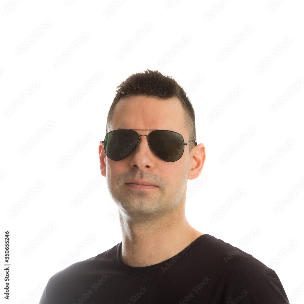 Headshot of a young man wearing aviator sunglasses, isolated on white Headshot of a young man wearing aviator sunglasses, isolated on white