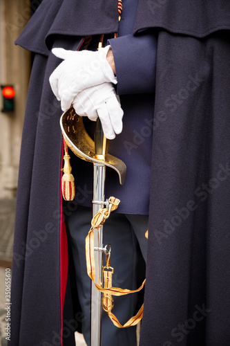 Εκτύπωση καμβά A guard of the Italian Corps of Cuirassiers stands with a sword in his hand in white gloves