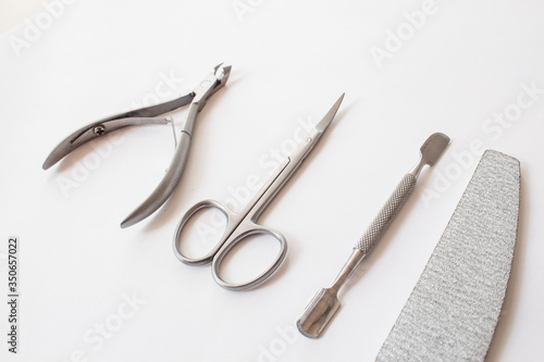  set of tools for manicure on a white background close-up. top view, text space.