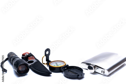 Flashlight, compass, knife, flask, hiking tools