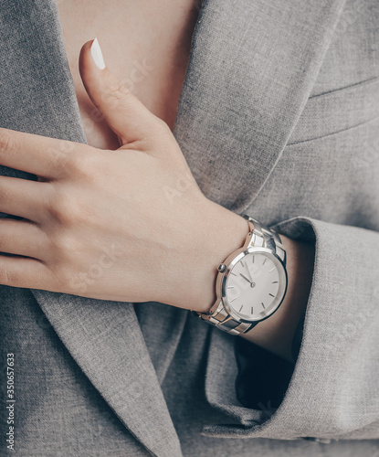 Stylish fashion elegant white watch on woman hand