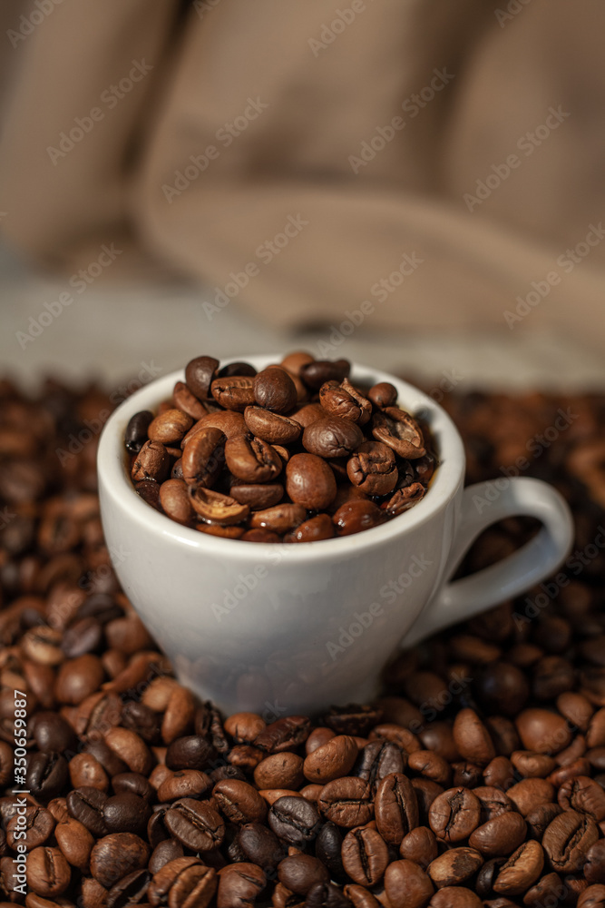 Fragrant coffee beans. Coffee in a cup. Fragrant drink. Fragrant coffee beans. Coffee in a cup. Fragrant drink.
