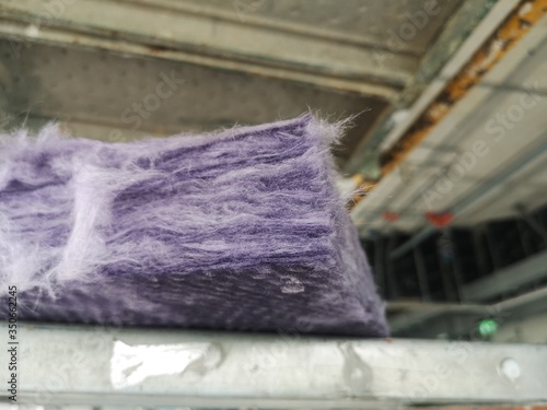 Fiberglass insulation that is put in sound insulation inside the building walls