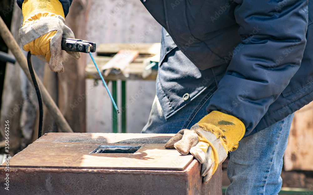 Metal welding by a manual electric welding machine. Metal welding by a manual electric welding machine.