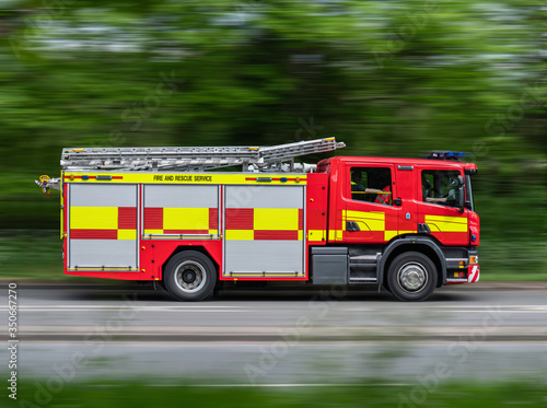 Canvas Print Fire Engine Driving Along Road