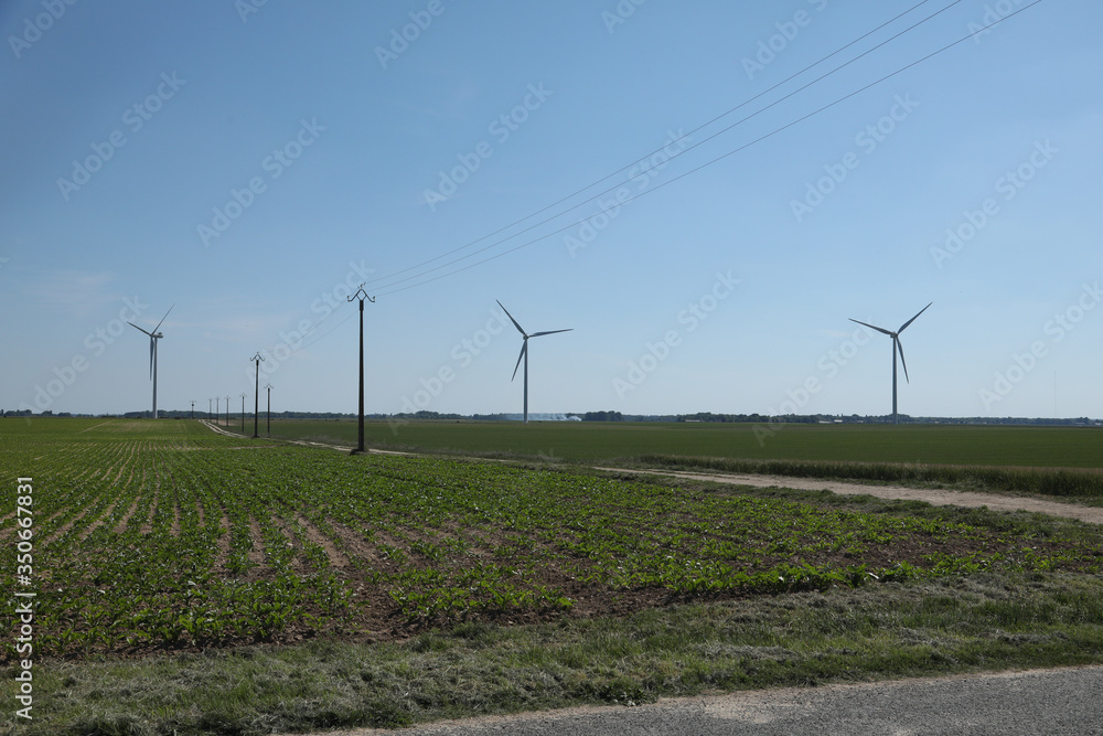 Windmill for electric power production, France. Blue sky Windmill for electric power production, France. Blue sky
