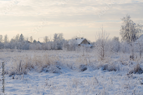 Winter landscape in the morning in the Russian village