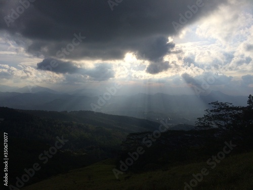 sunset in the mountains with beautiful sun rays like heaven si shining down on the earth 