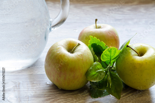green apples and glass of water