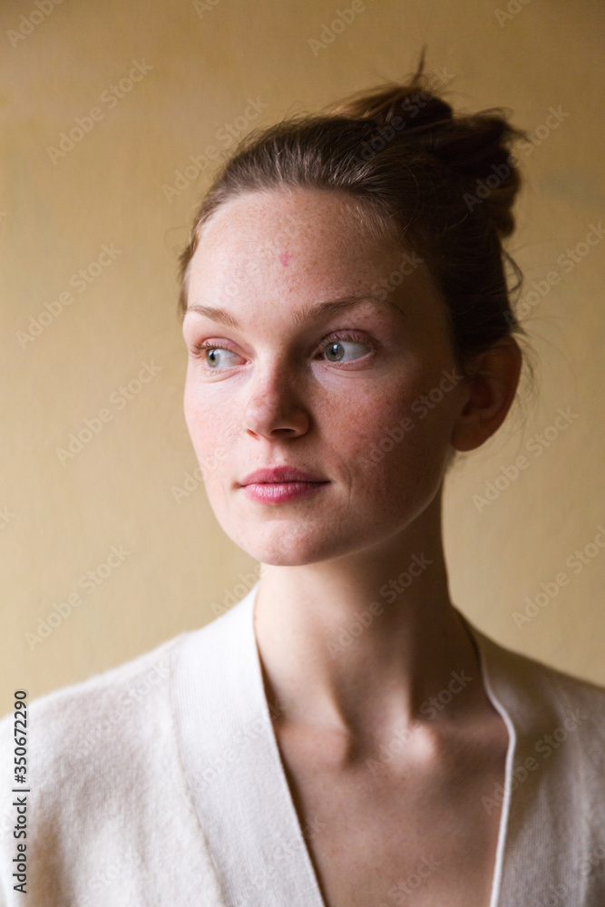Studio shot of young cute woman isolated on beige Studio shot of young cute woman isolated on beige