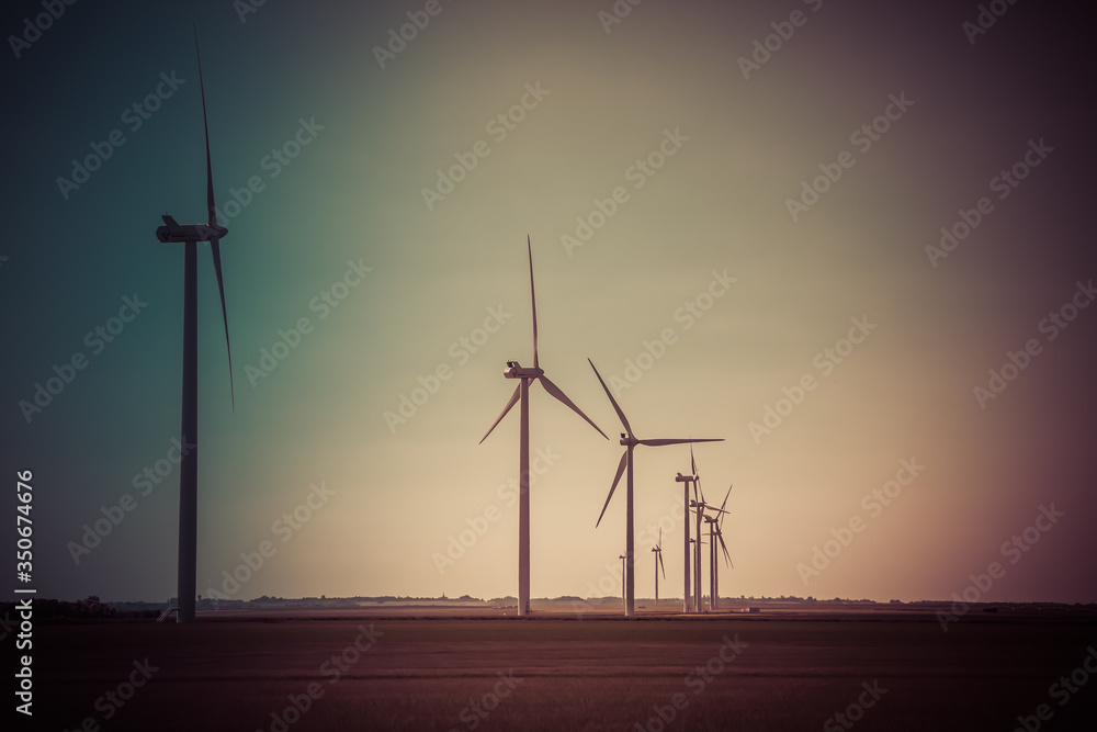 Obraz premium Windmill for electric power production, France. Blue sky
