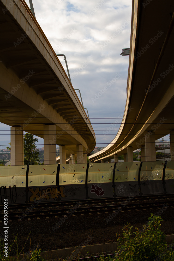 
RAILWAY AND TRAFFIC BRIDGE IN PRAGUE IN CZECH REPUBLIC. architecture of bridges and tracks for trains and public transport