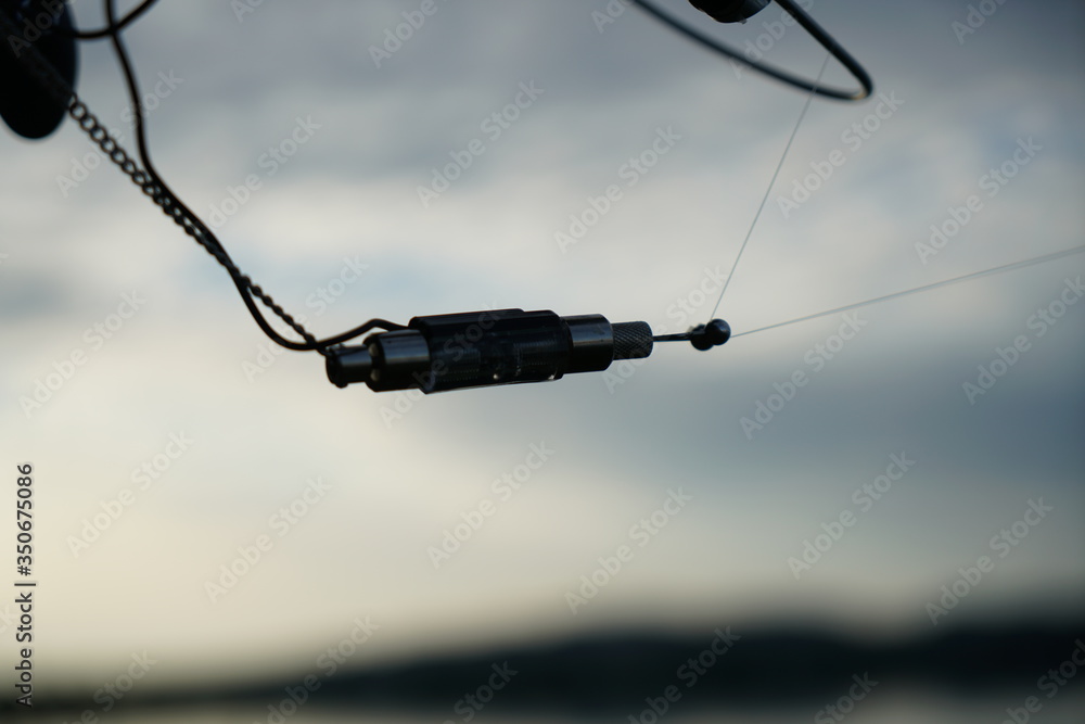 Fishing tackle photographed while fishing on the Danube on a midsummer afternoon Fishing tackle photographed while fishing on the Danube on a midsummer afternoon