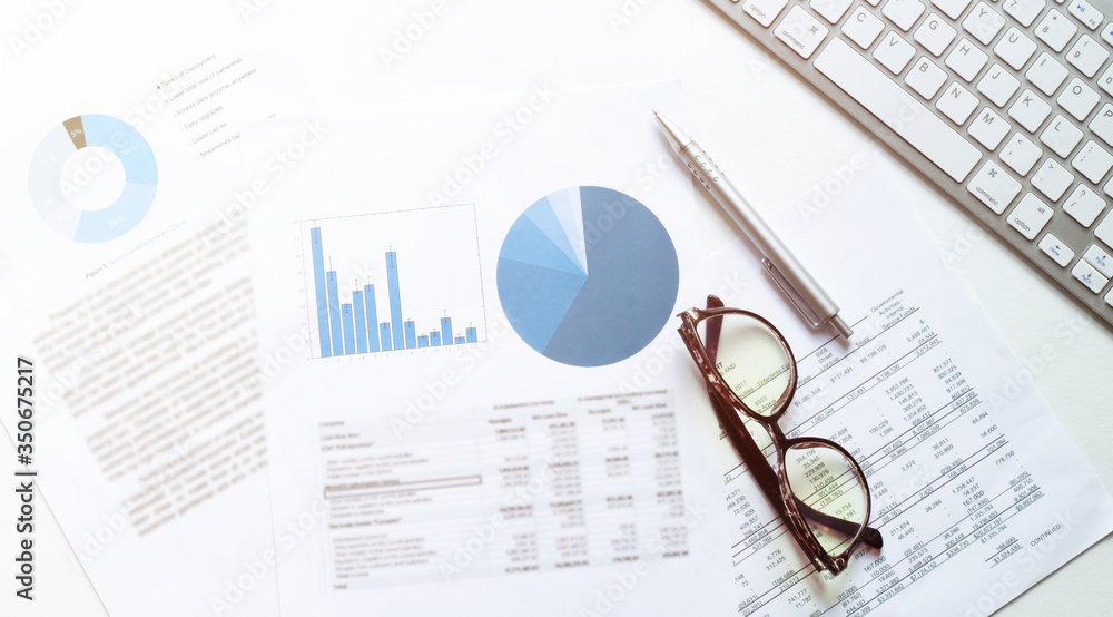 business accounter work with taxes and keyboard on white office desk ...