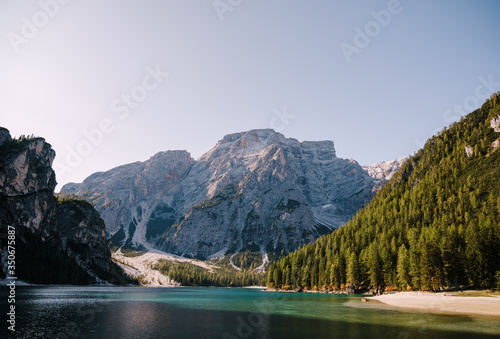 Rocky mountains with green forests at Lago di Braies. Braies lake in the Dolomites in South Tyrol, Italy, a municipality of Braies, in the Prague Valley.