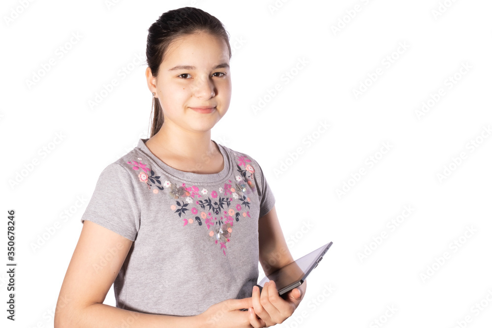 girl with black hair smiles and holds a tablet in his hands girl with black hair smiles and holds a tablet in his hands