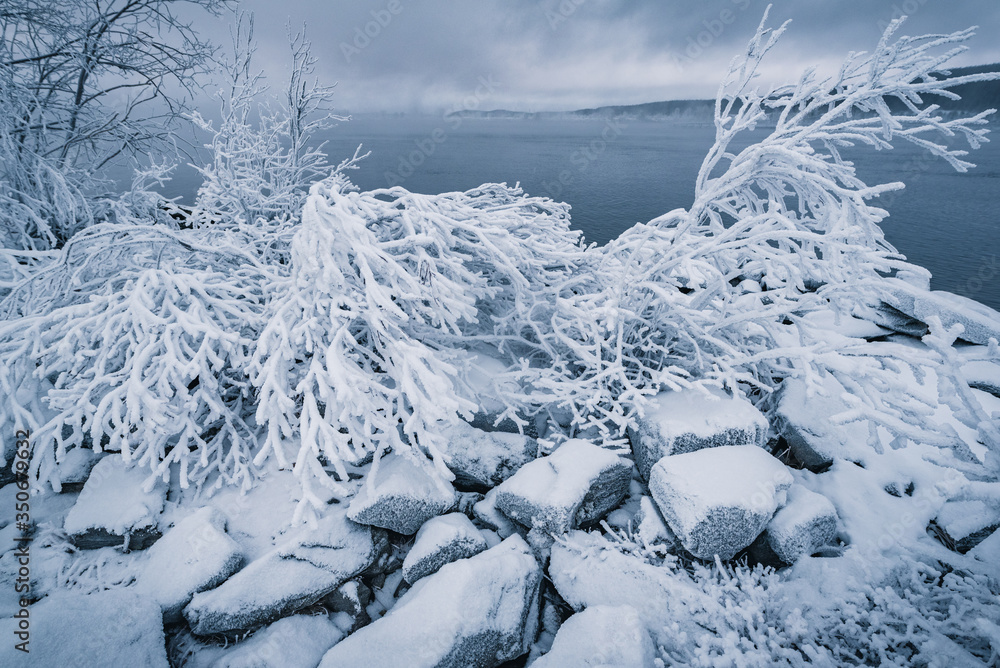 Frosty stones on the shore of Lake Babinskaya Imandra in the Arctic