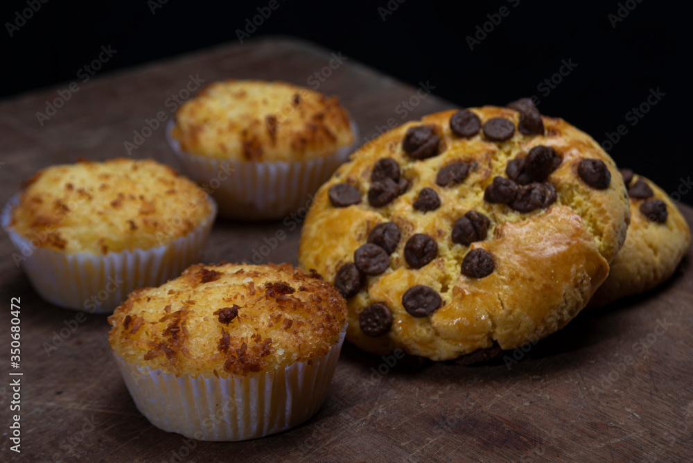Beautiful loaves and pastries in low light on black background Beautiful loaves and pastries in low light on black background