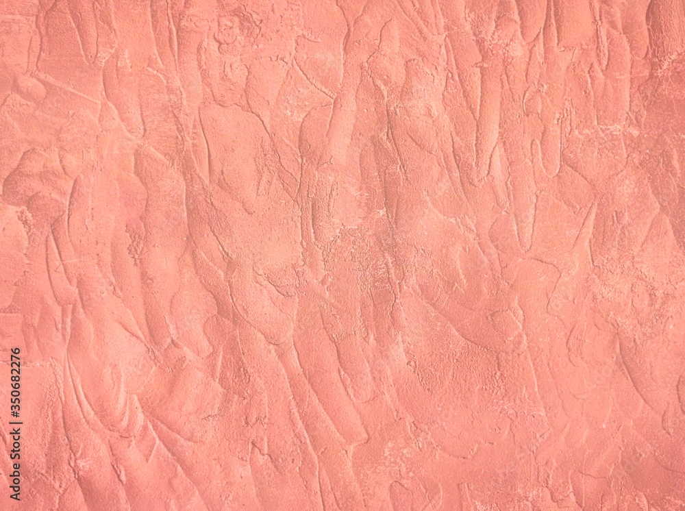 Concrete texture painted in trendy rose gold colour. Cement stucco wall background. Concrete texture painted in trendy rose gold colour. Cement stucco wall background.
