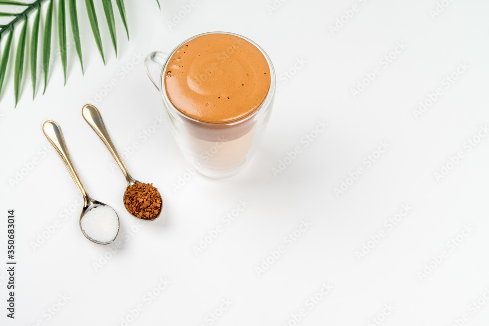 Trendy Korean dalgon coffee drink. An interesting variant of a milk drink with instant coffee Trendy Korean dalgon coffee drink. An interesting variant of a milk drink with instant coffee