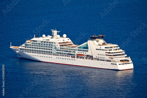 Unnamed cruise ship on blue sea aerial view